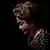 Profile shot of Brazil's impeached president Dilma Rousseff against a black backdrop.