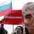 A January 2018 rally: The mask depicting Russian President Vladimir Putin reads "Thief"