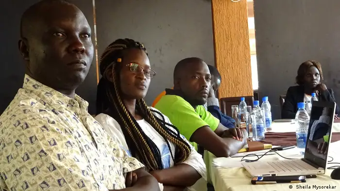 George Driliga, station manager of Morobo FM, and other journalists at a Cross-Border Network meeting in Kampala.
