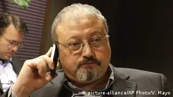Stock image of Jamal Khashoggi holding a mobile phone