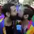 Two men kiss during a gay pride parade (23.06.19 AP/Nelson Antoine)