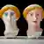 Three statue heads painted in different colors.
