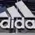 The Adidas logo in the front of a retail store