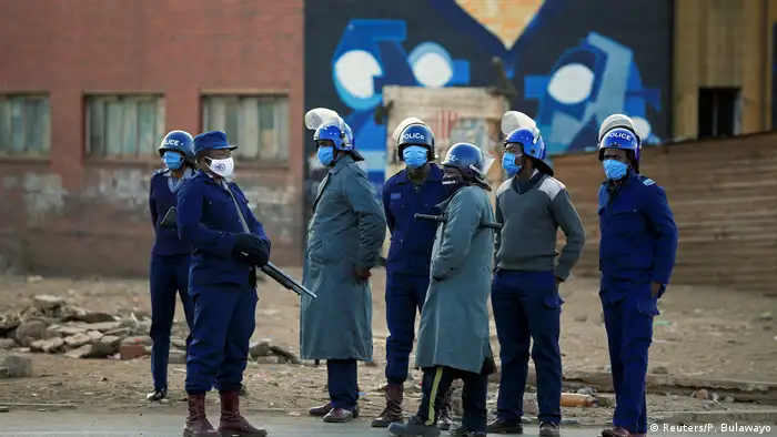 Police officers patrol the street ahead of planned anti-government protests during the coronavirus disease (COVID-19) outbreak in Harare, Zimbabwe, July 31, 2020. 