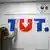 Логотип Tut.by на стене в офисе