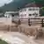 Water flowing into and past homes in Berchtesgadener Land, Bavaria