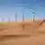Row of wind turbines in desert