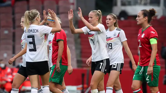 Kathrin Hendrich, Lea Schüller and Jule Brand celebrate one of Germany's goals against Bulgaria