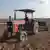 A farmer drives a tractor in Turkey.