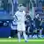 Bayern Munich's Joshua Kimmich stands disappointed as the VfL Bochum players celebrate behind him