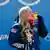 Kaillie Humphries of the USA kisses her gold medal won in the monobob