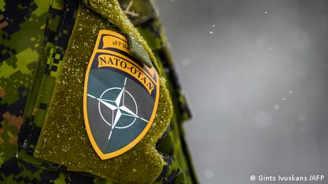 The NATO logo is seen on a uniform during the NATO annual military exercise Winter Shield 2021 in Adazi, Latvia