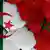 علم الجزائر وعلم المغرب على جدار مشقق (صورة مدمجة)