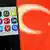 A symbolic image showing a phone with the logos of several popular social media and communication applications visible on its display screen, overlaid against the backdrop of a Turkish flag.