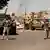 Libyan army forces and vehicles are stationed in a street in the country’s capital of Tripoli