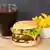 Fast food: Hamburger in a bun, fries and a glass of coke