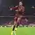 Jamal Musiala celebrates his goal against Bayer Leverkusen alone
