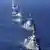 An aerial view shows Japan's Maritime Self-Defense Force (JMSDF)'s destroyer JS Asahi (DD-119) leading the fleet during the International Fleet Review to commemorate the 70th anniversary of the foundation of the JMSDF, at Sagami Bay, off Yokosuka, south of Tokyo