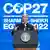 Joe Biden stands at a podest in front of a blue COP27 banner