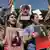 Women chant slogans and hold up signs depicting the image of 22-year-old Mahsa Amini, who died while in the custody of Iranian authorities, during a demonstration in Erbil, Iraq. 