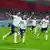 England players celebrate scoring a goal