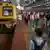 Commuters alight from a suburban train at the Chhatrapati Shivaji Maharaj Terminus railway station in Mumbai