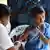 A school girl in India gets a measles and rubella vaccine