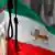 A noose hangs in front of the Iranian flag