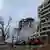 Пожарный автомобиль около разрушенного многоэтажного дома в Днепре