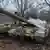 Украинский военный рядом с танком