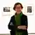 Барбара Клемм на фоне своих работ на выставке в Оберхаузене