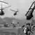 A black and white photo of US helicopters and soldiers in Vietnam