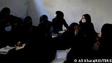 Women and girls reading from the Quran in a Kabul madrasa in October 2022