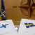 Заявки на вступление в НАТО Швеция и Финляндия лежат на столе на фоне флагов двух стран и НАТО