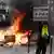 In Paris, Fire is set during the demonstration after the government pushed a pensions reform through parliament without a vote, using the article 49.3 of the constitution, in Paris on March 28, 2023.