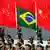 A Chinese military honor guard holds the national flags of China and Brazil