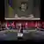 Изображение президента Украины Владимира Зеленского на экране в зале заседаний саммита Совета Европы в Рейкьявике