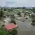 Затоплені внаслідок руйнування греблі Каховської ГЕС будинки в Херсоні, фото 7 червня 2023 року