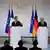 المستشار الألماني أولاف شولتس والرئيس الفرنسي إيمانويل ماكرون والرئيس البولندي أندري دودا في مؤتمر صفحي في باريس 12/6/ 2023