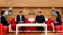 In this Thursday, June 20, 2019, photo provided by the North Korean government, North Korean leader Kim Jong Un, center right, and his wife Ri Sol Ju, right, meet Chinese President Xi Jinping, center left, and his wife Peng Liyuan at Kumsusan guest house in Pyongyang, North Korea. The content of this image is as provided and cannot be independently verified. Korean language watermark on image as provided by source reads: KCNA which is the abbreviation for Korean Central News Agency. (Korean Central News Agency/Korea News Service via AP)