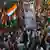 Congress party workers celebrate in West Bengal on Friday after a court judgment