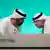 COP28 President Sultan al-Jaber, left, and COP28 Director-General Ambassador Majid Al Suwaidi talk at the climate summit in Dubai 