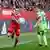 Magull gets past Rausch as the two face one another in a Bayern Munich vs. Wolfsburg game
