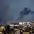 Smoke billows over buildings in Rafah in January 2024