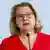 La ministre fédérale allemande du Développement, Svenja Schulze s'exprimant devant un micro