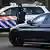 A vehicle carrying suspects arrives at the high security court in Amsterdam, Netherlands