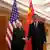 Američka ministrica financija Janet Yellen i kineski potpredsjednik vlade He Lifeng u Pekingu pred zastavama obje zemlje i tradicionalnim kineskim paravanom od drva 