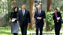FILE - In this photo released by Xinhua News Agency, Chinese President Xi Jinping, second from left, and German Chancellor Olaf Scholz, second from right, walk together in Beijing, China, on Tuesday, April 16, 2024. Europe wants two things from China: First, a shift in its relatively pro-Russia position on the war in Ukraine. Second, a reduction in the trade imbalance. It’s not clear if it will get very far on either front. (Ding Haitao/Xinhua via AP, File)