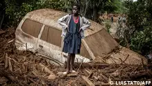 TOPSHOT - A girl looks on next to a damaged car buried in mud in an area heavily affected by torrential rains and flash floods in the village of Kamuchiri, near Mai Mahiu, on April 29, 2024. At least 45 people died when a dam burst its banks near a town in Kenya's Rift Valley, police said on April 29, 2024, as torrential rains and floods battered the country.
The disaster raises the total death toll over the March-May wet season in Kenya to more than 120 as heavier than usual rainfall pounds East Africa, compounded by the El Nino weather pattern. (Photo by LUIS TATO / AFP)
